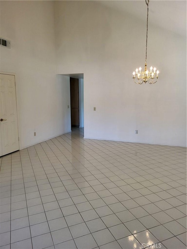 40132 Zamura Ct, Murrieta, CA 92562 - unfurnished room with a towering ceiling, a chandelier, and light tile patterned floors