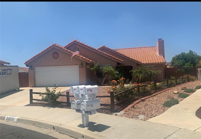 29331 Mawr Ct, Menifee, CA 92586 - mediterranean / spanish-style home with a tiled roof, stucco siding, concrete driveway, and an attached garage
