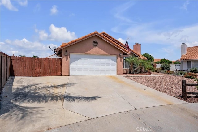 29331 Mawr Ct, Menifee, CA 92586 - view of front of house featuring concrete driveway, stucco siding, a garage, and a tiled roof