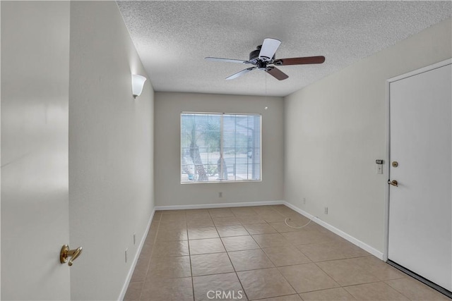 29331 Mawr Ct, Menifee, CA 92586 - tiled spare room with a textured ceiling, a ceiling fan, and baseboards