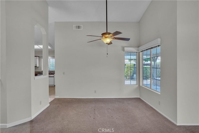 29331 Mawr Ct, Menifee, CA 92586 - carpeted empty room featuring a ceiling fan, baseboards, and a towering ceiling