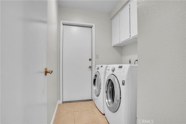 29331 Mawr Ct, Menifee, CA 92586 - laundry room with washing machine and clothes dryer, cabinet space, light tile patterned flooring, and baseboards