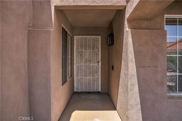 29331 Mawr Ct, Menifee, CA 92586 - view of exterior entry with stucco siding