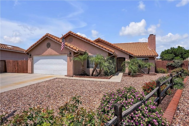 29331 Mawr Ct, Menifee, CA 92586 - mediterranean / spanish house featuring an attached garage, stucco siding, a chimney, concrete driveway, and a tiled roof