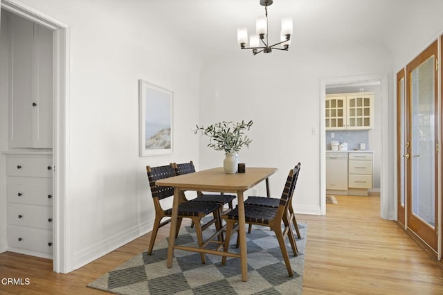 2371 Foster Ave, Ventura, CA 93001 - dining room with light wood-style floors, a chandelier, and baseboards