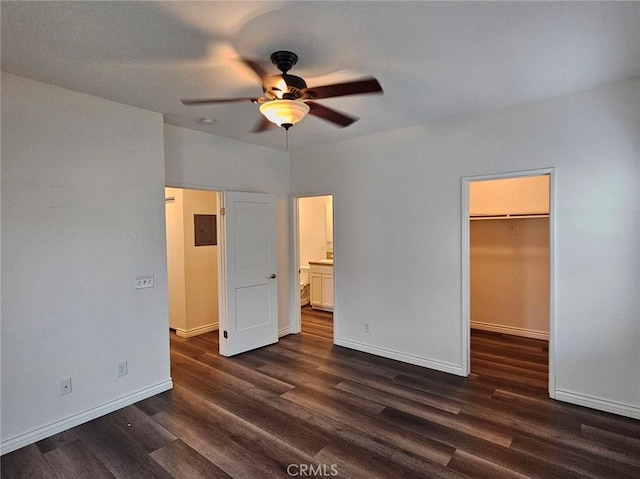 7331 Shelby Pl Unit 121, Rancho Cucamonga, CA 91739 - unfurnished bedroom with a walk in closet, dark wood finished floors, baseboards, and a closet