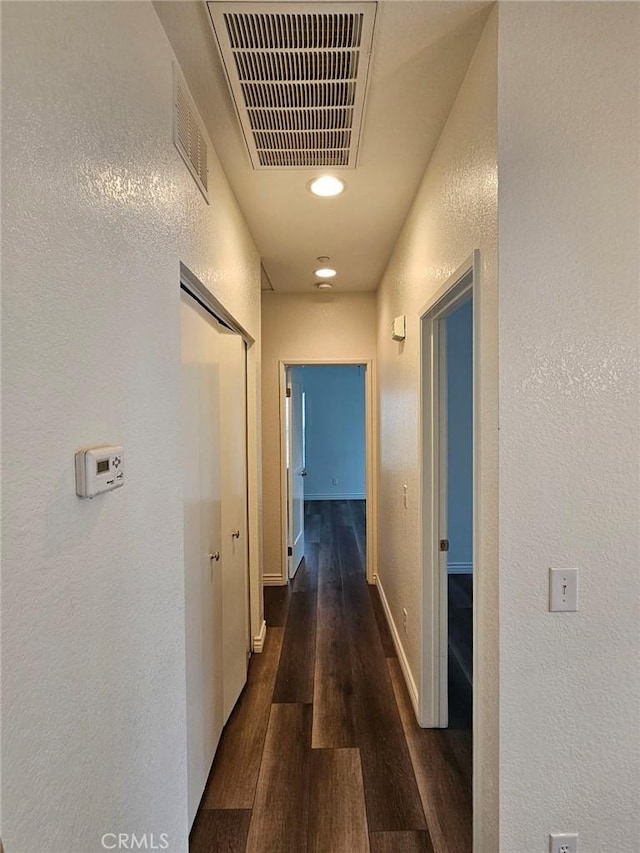 7331 Shelby Pl Unit 121, Rancho Cucamonga, CA 91739 - hall with wood finished floors, a textured wall, and baseboards