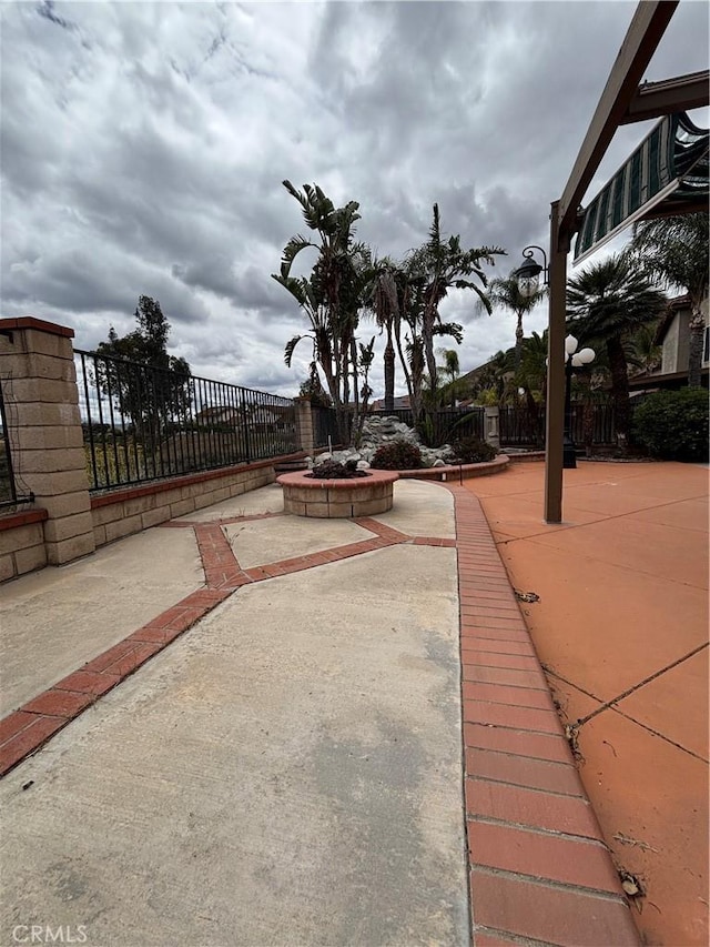 17092 Whispering Brook Way, Riverside, CA 92503 - fenced backyard featuring a patio and an outdoor fire pit