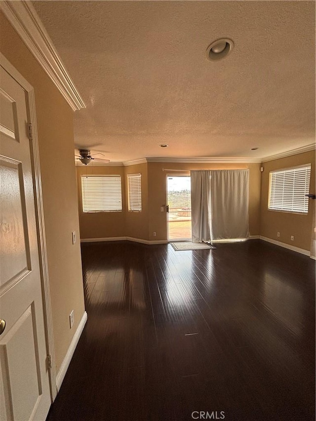 17092 Whispering Brook Way, Riverside, CA 92503 - spare room featuring crown molding, ceiling fan, baseboards, a textured ceiling, and dark wood-type flooring