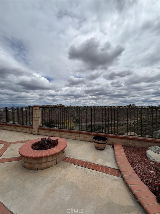 17092 Whispering Brook Way, Riverside, CA 92503 - view of patio / terrace with a fire pit and a fenced backyard