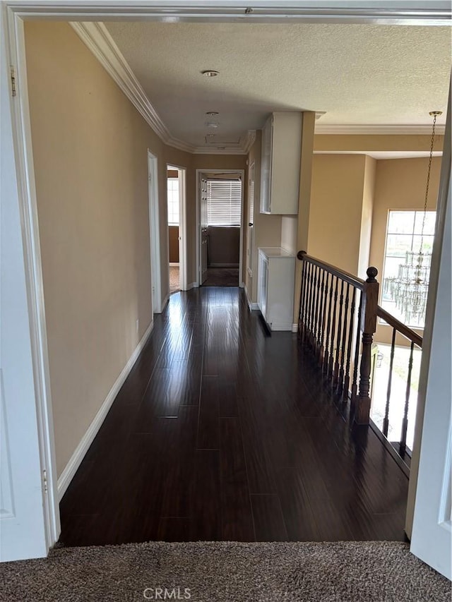 17092 Whispering Brook Way, Riverside, CA 92503 - hall featuring dark wood finished floors, baseboards, ornamental molding, and an upstairs landing
