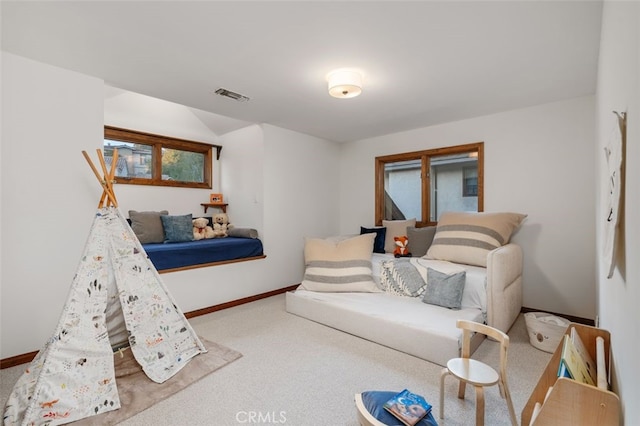 carpeted bedroom with baseboards