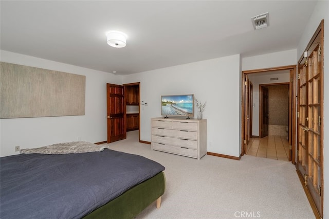 carpeted bedroom featuring baseboards