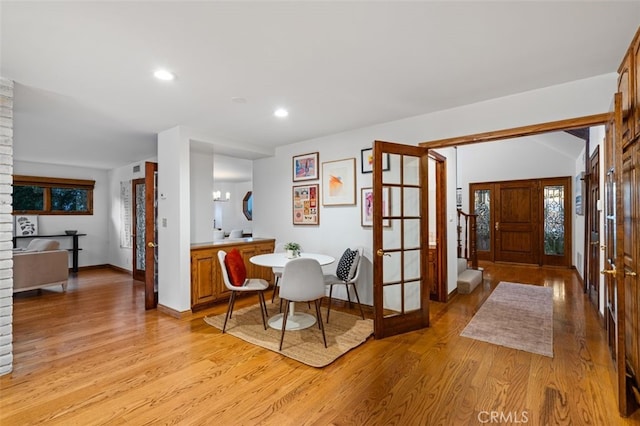 dining space featuring light wood-type flooring, baseboards, and recessed lighting