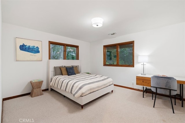 carpeted bedroom with baseboards