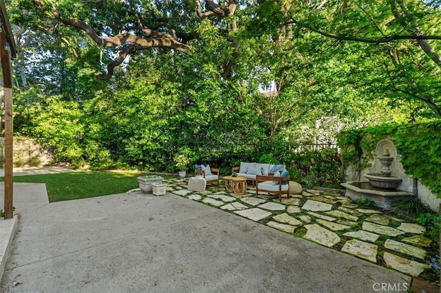 view of patio / terrace featuring outdoor lounge area and fence