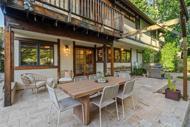 view of patio / terrace with area for grilling, french doors, and outdoor dining space