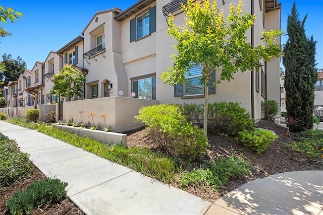 7501 Eagle Dr Unit 101, Santee, CA 92071 - view of building exterior featuring fence, central AC, and a residential view