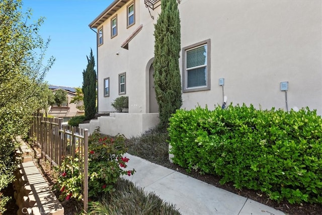 7501 Eagle Dr Unit 101, Santee, CA 92071 - view of side of property featuring fence and stucco siding
