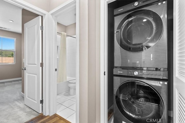 7501 Eagle Dr Unit 101, Santee, CA 92071 - clothes washing area featuring stacked washing machine and dryer and baseboards