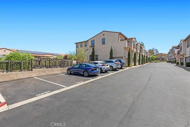 7501 Eagle Dr Unit 101, Santee, CA 92071 - uncovered parking lot featuring a residential view