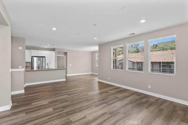 7501 Eagle Dr Unit 101, Santee, CA 92071 - unfurnished living room with baseboards, wood finished floors, recessed lighting, and a sink