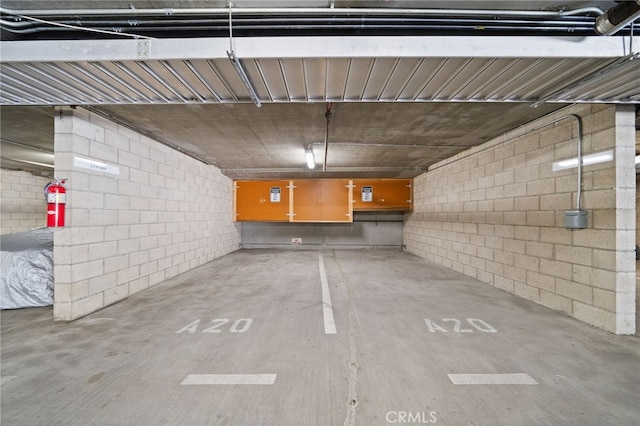 parking deck featuring concrete block wall