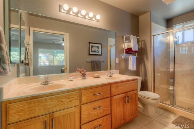 324 Crater Lake Dr, Chico, CA 95973 - bathroom featuring tile patterned floors, double vanity, toilet, and a stall shower