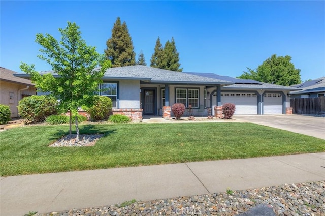 324 Crater Lake Dr, Chico, CA 95973 - single story home featuring a garage, roof mounted solar panels, driveway, and stucco siding