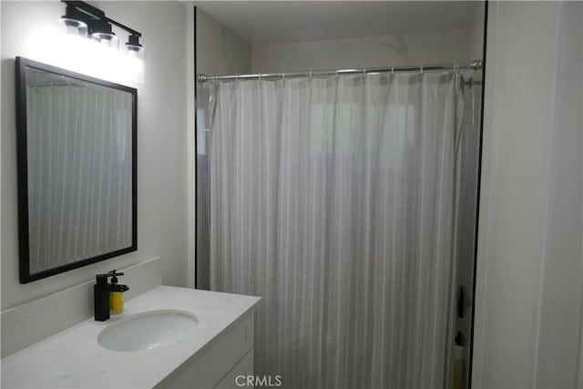bathroom with vanity and a shower with curtain