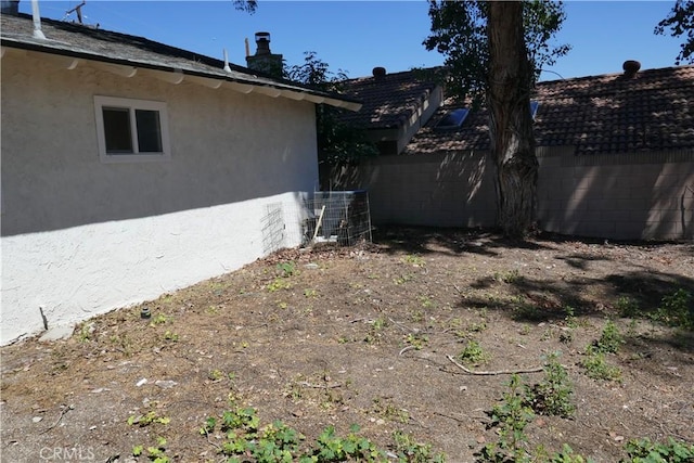 view of yard with fence and cooling unit