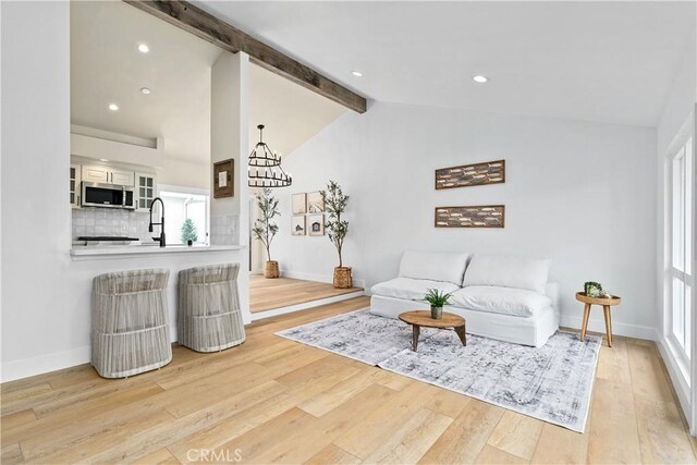 249 Calle Empalme, San Clemente, CA 92672 - living room with wood finished floors, a chandelier, baseboards, plenty of natural light, and recessed lighting