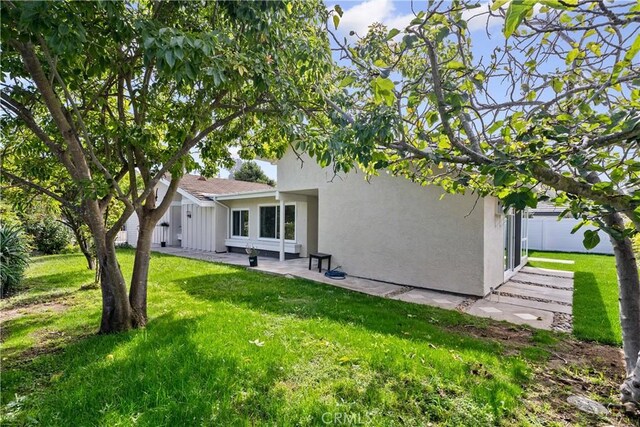 249 Calle Empalme, San Clemente, CA 92672 - back of house with stucco siding and a lawn