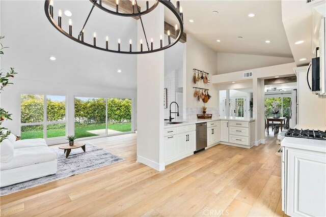 249 Calle Empalme, San Clemente, CA 92672 - kitchen with appliances with stainless steel finishes, open floor plan, a sink, light countertops, and plenty of natural light