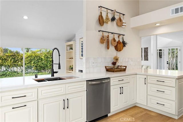 249 Calle Empalme, San Clemente, CA 92672 - kitchen with dishwasher, a sink, healthy amount of natural light, tasteful backsplash, and lofted ceiling