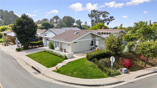 249 Calle Empalme, San Clemente, CA 92672 - view of front facade featuring a garage, a front yard, driveway, and a tiled roof