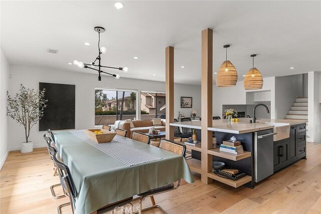 5681 E Colorado St, Long Beach, CA 90814 - dining area featuring light wood-style floors, a chandelier, recessed lighting, and baseboards