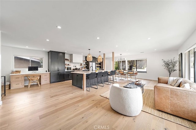 5681 E Colorado St, Long Beach, CA 90814 - living room featuring recessed lighting, plenty of natural light, and light wood-style flooring