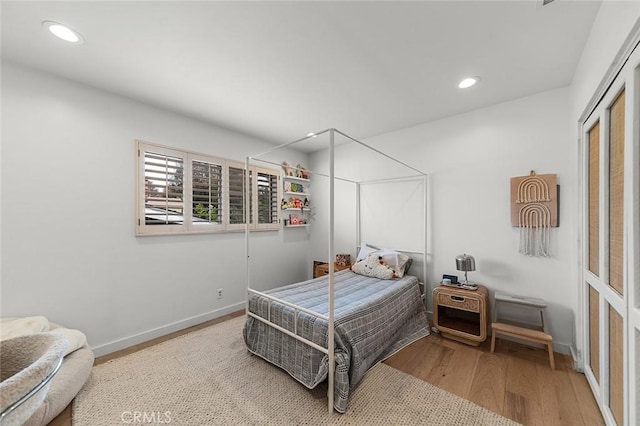 5681 E Colorado St, Long Beach, CA 90814 - bedroom featuring wood finished floors, recessed lighting, and baseboards