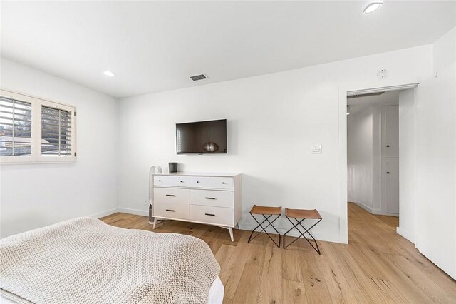 5681 E Colorado St, Long Beach, CA 90814 - bedroom featuring light wood-style flooring, recessed lighting, and baseboards