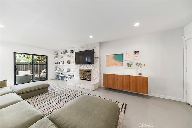 5681 E Colorado St, Long Beach, CA 90814 - living area featuring concrete floors, recessed lighting, baseboards, and a fireplace