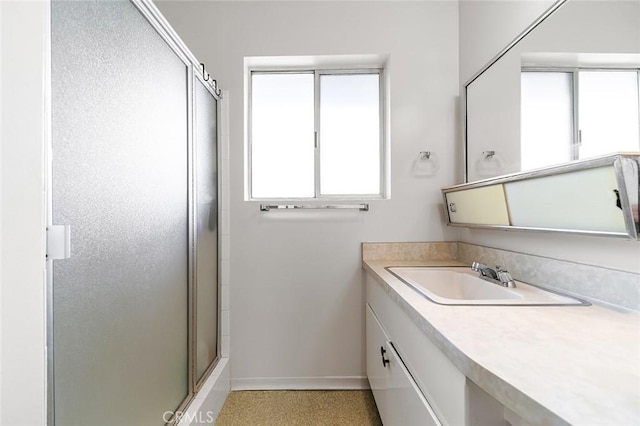 5681 E Colorado St, Long Beach, CA 90814 - full bathroom featuring baseboards, a shower with shower door, and vanity