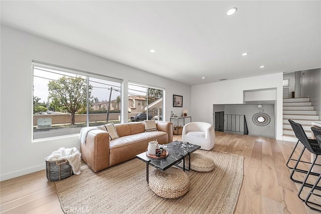 5681 E Colorado St, Long Beach, CA 90814 - living room featuring stairs, light wood-style flooring, recessed lighting, and baseboards