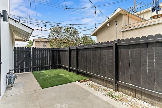 5681 E Colorado St, Long Beach, CA 90814 - fenced backyard featuring a patio area and a gate