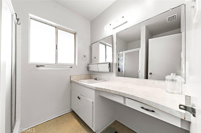 5681 E Colorado St, Long Beach, CA 90814 - bathroom featuring baseboards, a stall shower, and vanity