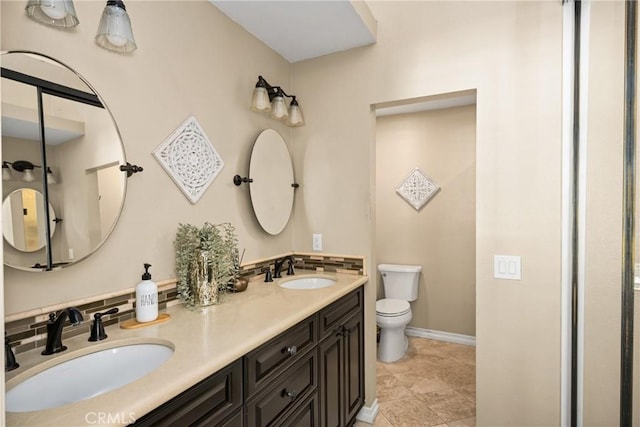 26065 Las Flores Unit C, Mission Viejo, CA 92691 - full bathroom with toilet, double vanity, and baseboards