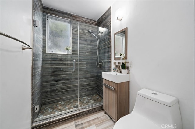 617 Cedar Ave Unit 11, Long Beach, CA 90802 - bathroom with toilet, vanity, and a shower stall
