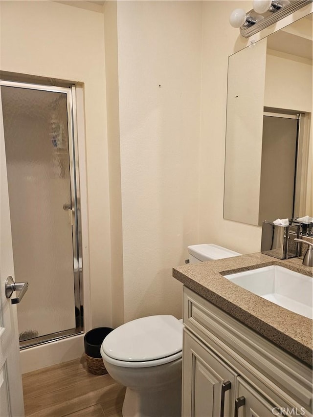 9315 Woodman Ave Unit 8, Arleta, CA 91331 - full bath featuring a shower stall, vanity, wood finished floors, and toilet