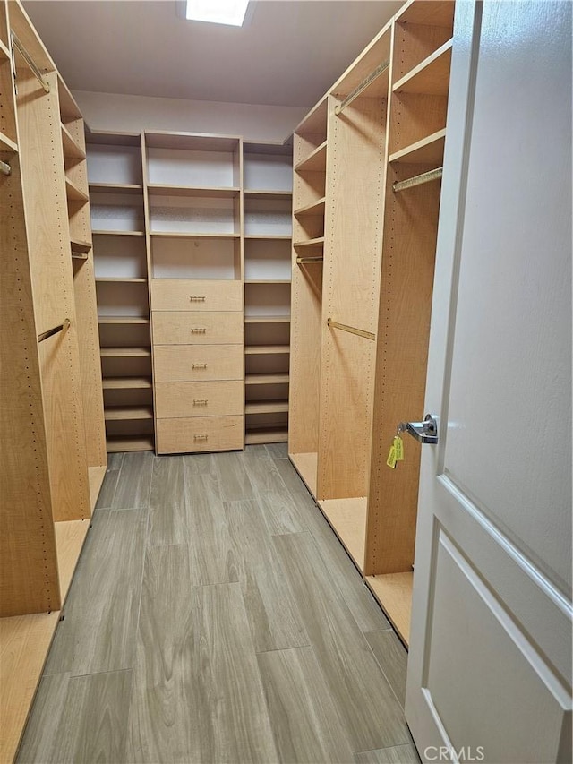 9315 Woodman Ave Unit 8, Arleta, CA 91331 - walk in closet featuring light wood-type flooring