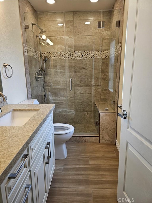 9315 Woodman Ave Unit 8, Arleta, CA 91331 - full bath with vanity, wood finished floors, toilet, a shower stall, and recessed lighting